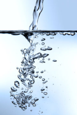 water splashing isolated on blue background
